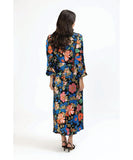 Woman wearing a colorful floral dress on a white background Seeking Lola Elegant Dress - Fantasia