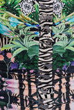 Close-up of a ruched garment featuring a mixed print design with green tropical leaves, black and white zebra stripes, and pink floral patterns.