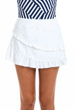 White tiered ruffle mini skirt worn by a model, paired with a navy and white striped top, shown from the waist down on a white background.