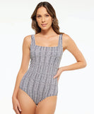Togs Yukon Square Binding One piece. A woman wearing a black and white geometric patterned one-piece swimsuit with a square neckline and binding details.