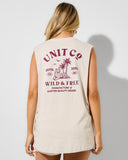 A woman shown from the back wearing a sleeveless cream-colored tunic top with a large maroon graphic print on the back. The print features the text 'UNIT CO', 'WILD & FREE', and a tropical island illustration. Unit Ladies Muscles Tank - Lodge