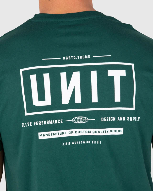 A close-up of a person wearing a dark green t-shirt, showing the back of the shirt with a large white graphic print that reads 'UNIT' and 'ROSTO.TROMK'. Unit Mens Tees - Index - Forest Green