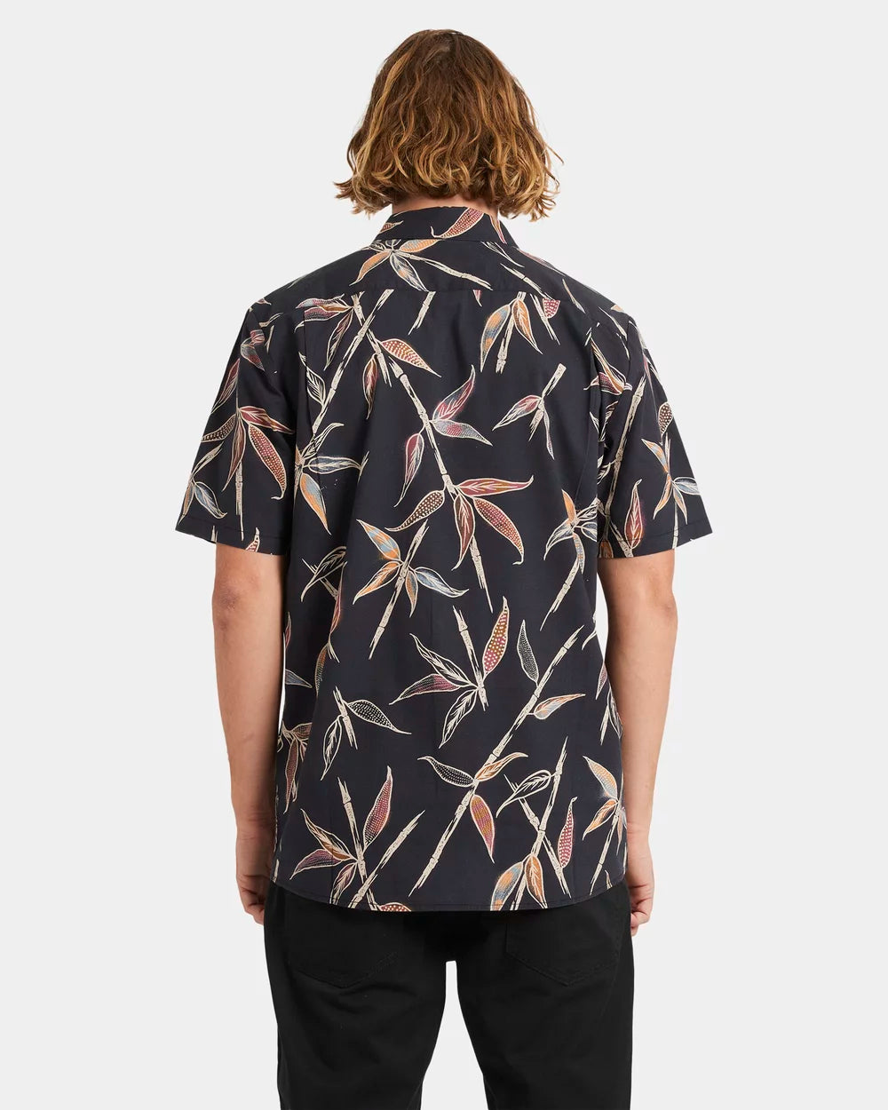 Person wearing a dark patterned shirt with leaf design on a white background Volcom Scaler Stone Woven SS Shirt - Vintage Black