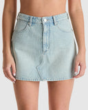 Light blue denim skirt worn by a person on a white background