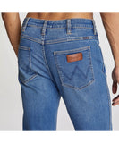 Wrangler Stomper Two Hands - Blue close up view of mens jeans back pocket