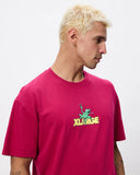Image Alt Text: XLarge Peace Frog SS Tee in Pigment Plum showing the front screen printed frog chest graphic, sold by Point Break Cambridge local family surf shop at 63 Duke street.