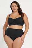 Woman wearing a black bikini set on a white background