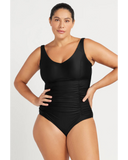 Front full-length view of the black Artesands Hues Raphael swimsuit showing modest V-neck and ruched tummy panels.