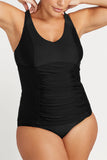 Front view close up of the black Artesands Hues Raphael tankini top showing the classic crossover ruching and long torso length.