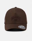 Text: Billabong Arch Flexfit 110 Snapback Cap in Coffee Bean front view showcasing the rich brown colourway structured five-panel crown curved Permacurv visor and classic surf-inspired cap silhouette, sold by Point Break Cambridge local family surf shop at 63 Duke Street.