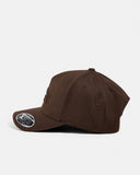 Billabong Arch Flexfit 110 Snapback Cap in Coffee Bean side profile view showcasing the structured five-panel silhouette shape-retaining curved peak comfortable stretch fabric construction and versatile earthy brown colourway, sold by Point Break Cambridge local family surf shop at 63 Duke Street.