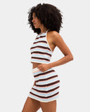 Billabong Beach Crush Knit Skirt in Multi side profile view showcasing the flattering fitted mini skirt silhouette comfortable elasticated waist soft cotton knit texture vibrant multicoloured stripes and delicate scalloped hem detail, sold by Point Break Cambridge local family surf shop at 63 Duke Street.