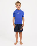 Billabong Boys Groms All Day Arch Rashguard in Cobalt blue front view showing the comfortable crew neck long sleeve sun protection layout and clean chest brand graphic logo print, sold by Point Break Cambridge local family surf shop at 63 Duke street.