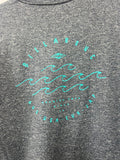 Gray t-shirt with teal branding and text on a plain background