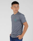 Person wearing a gray t-shirt with a small logo on a plain background