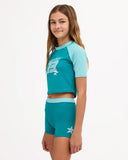 Billabong Girls Billa Star Rash Guard Set in Evergreen side profile view showcasing the comfortable rash guard top coordinating swim bottoms streamlined swimwear fit and practical coverage for active beach adventures, sold by Point Break Cambridge local family surf shop at 63 Duke Street.