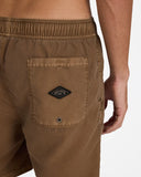 Billabong Mens All Day Overdyed Layback 17 inch Boardshorts in Coffee Bean brown close up view highlighting the premium water resistant overdyed fabric texture branded drawcord tips and secure pocket drainage eyelet detail, sold by Point Break Cambridge local family surf shop at 63 Duke street.