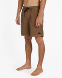 Billabong Mens All Day Overdyed Layback 17 inch Boardshorts in Coffee Bean brown side profile view highlighting the modern 17 outseam hemline and comfortable relaxed leg opening architecture, sold by Point Break Cambridge local family surf shop at 63 Duke street.