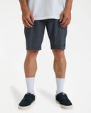 Billabong Mens Crossfire Hybrid Walkshorts in Black front view showing the comfortable fixed waistband traditional button closure zip fly layout and deep side hand pocket entry lines, sold by Point Break Cambridge local family surf shop at 63 Duke street.