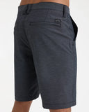 Billabong Mens Crossfire Hybrid Walkshorts in Black side profile view highlighting the modern active outseam hemline length and comfortable relaxed leg opening architecture, sold by Point Break Cambridge local family surf shop at 63 Duke street.