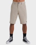Billabong Mens Crossfire Hybrid Walkshorts in Khaki sand front view showing the comfortable fixed waistband traditional button closure zip fly layout and deep side hand pocket entry lines, sold by Point Break Cambridge local family surf shop at 63 Duke street.