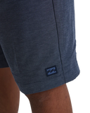 Billabong Mens Crossfire Hybrid Walkshorts in Navy blue close up view highlighting the premium quick dry water repellent woven fabric texture custom branded button and heavy duty pocket seam stitching details, sold by Point Break Cambridge local family surf shop at 63 Duke street.