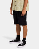 Billabong Mens Larry Corduroy Walkshorts in Char side profile view showcasing the comfortable mid-length 18-inch outseam, relaxed casual silhouette, practical side entry pockets, soft cotton corduroy construction and classic charcoal colourway, sold by Point Break Cambridge local family surf shop at 63 Duke Street.