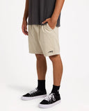 Billabong Mens Larry Corduroy Walkshorts in Stone tan side profile view highlighting the comfortable outseam rise relaxed leg opening depth and clean lower hemline profile, sold by Point Break Cambridge local family surf shop at 63 Duke street.