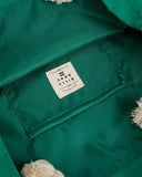 Billabong Pacific Beach Bag in Summer Green close up view highlighting the premium textured woven fabric weave pattern secure internal zipper pocket lining and detailed brand badge hardware, sold by Point Break Cambridge local family surf shop at 63 Duke street.