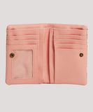 Internal open view of the pink Billabong Kirra wallet displaying the multiple card slots and central zip coin compartment.