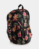 Billabong Sweet Tropics Roadie Backpack in Black Multi side profile view showcasing the spacious 31-litre storage capacity elasticated side water bottle pockets multiple zippered compartments and distinctive tropical floral print, sold by Point Break Cambridge local family surf shop at 63 Duke Street.