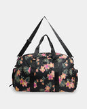 Billabong Weekend Seeker Duffle Bag in Black Multi front view showcasing the spacious 45-litre travel bag silhouette durable recycled polyester construction comfortable carry handles and signature Billabong rubber logo patch, sold by Point Break Cambridge local family surf shop at 63 Duke Street.