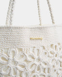 Billabong Wild Daisies Tote Bag in Salt Crystal close up view highlighting the intricate crochet daisy flower detailing textured woven construction soft cotton interior lining secure snap closure and quality handcrafted-inspired floral design, sold by Point Break Cambridge local family surf shop at 63 Duke Street.