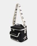 Billabong Womens La Lune Cooler Bag in Black Pebble side profile view showcasing the compact 15cm bag depth adjustable branded webbing shoulder strap convenient carry handle and practical insulated cooler bag construction, sold by Point Break Cambridge local family surf shop at 63 Duke Street.