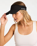 Billabong Womens Pacific Day Visor in Black front view showing the textured woven straw sun brim open crown architecture and metal brand logo badge layout, sold by Point Break Cambridge local family surf shop at 63 Duke street.
