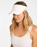 Billabong Womens Pacific Day Visor in Salt Crystal off-white front view showing the textured woven straw sun brim open crown architecture and metal brand logo badge layout, sold by Point Break Cambridge local family surf shop at 63 Duke street.