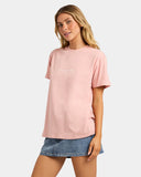 Billabong Womens Pacific Tee in Pale Peach side profile view showcasing the comfortable relaxed t-shirt silhouette lightweight cotton jersey construction classic short sleeves and easy-wearing casual coastal style, sold by Point Break Cambridge local family surf shop at 63 Duke Street.
