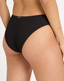 Billabong Womens Summer Hi Bondi Bikini Bottom in Black Sands charcoal black close up view highlighting the premium soft ribbed texture fabric weave pattern, seamless edge lining, and metal brand logo badge detail, sold by Point Break Cambridge local family surf shop at 63 Duke street.