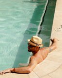 Brixton Castor Fedora in Tan front view showcasing the classic vintage-inspired fedora silhouette, premium woven paper straw construction, structured centre-dent crown, medium-stiff upturned brim and elegant grosgrain hatband, sold by Point Break Cambridge local family surf shop at 63 Duke Street.
