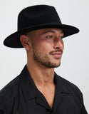 Brixton Messer Packable Fedora in Black Black front view showing the structured crease resistant crown flat protective sun brim and matching tonal felt band layout, sold by Point Break Cambridge local family surf shop at 63 Duke street.