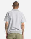 Brixton Trolly Jacquard Weekend Polo in Blue Aura teal back view showing the relaxed straight silhouette drape and premium continuous jacquard texture panel stitching layout, sold by Point Break Cambridge local family surf shop at 63 Duke street.