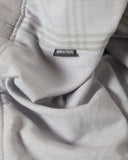 Brixton Trolly Jacquard Weekend Polo in Blue Aura teal close up view highlighting the premium soft cotton blend jacquard textured fabric weave pattern buttons and collar stitch finish, sold by Point Break Cambridge local family surf shop at 63 Duke street.