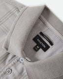 Brixton Trolly Jacquard Weekend Polo in Blue Aura teal close up view highlighting the premium soft cotton blend jacquard textured fabric weave pattern buttons and collar stitch finish, sold by Point Break Cambridge local family surf shop at 63 Duke street.
