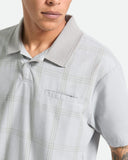 Brixton Trolly Jacquard Weekend Polo in Blue Aura teal close up view highlighting the premium soft cotton blend jacquard textured fabric weave pattern buttons and collar stitch finish, sold by Point Break Cambridge local family surf shop at 63 Duke street.