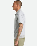 Brixton Trolly Jacquard Weekend Polo in Blue Aura teal side profile view showing the comfortable casual short sleeve length and clean flat stitched lower hemline layout, sold by Point Break Cambridge local family surf shop at 63 Duke street.