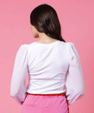 Back view of the ladies Charlo Ella blouse displaying the clean shoulder drape and fluid, non-clingy hemline.