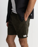 Person wearing dark green shorts with a visible brand logo on a white background Rhythm Mens Classic Chord Jam - Olive