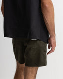 Person wearing a black shirt and green shorts on a white background Rhythm Mens Classic Chord Jam - Olive