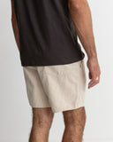 Model wearing the Rhythm Mens Classic Linen Jam Short - Sand on a plain background