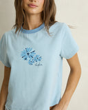 Model wearing the Rhythm Daisy Floral Stripe Tee - Baby Blue on a plain background